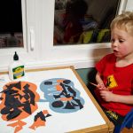 halloween craft, gluing faces on the pumpkins...sort of