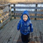 Isaac loves feeding the birds