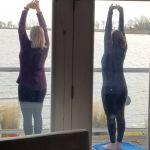 yoga on the balcony overlooking the lake with Laura
