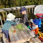 helping to make dinner, cutting beans