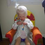 trying to do up her zipper