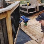 helping to put down the deck boards