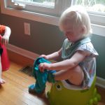 trying to put on shorts