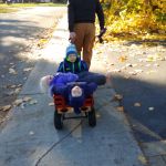 they barely all fit in the wagon with their snow suits on