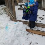 Isaac and Gale spraying the snow with colour