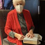 Grandma opening her Christmas present