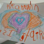 it says Maman Je T'aime (just backwards which I have to say is talent in itself)