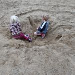 playing in the big hole at the park